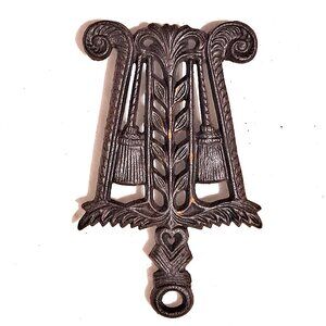 Vintage Cast Iron Trivet – Tassel, Broomsticks & Wheat Design